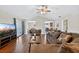 Spacious living room featuring wood flooring and french doors with natural light at 1922 Matthew Ct, Lakeland, FL 33813