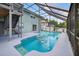 Inviting pool with a screened enclosure and an inflatable mattress for relaxing afternoons at 1922 Matthew Ct, Lakeland, FL 33813
