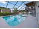 Beautiful backyard pool with screened enclosure for enjoying swimming year-round at 1922 Matthew Ct, Lakeland, FL 33813
