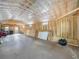 Spacious garage with wood beam ceiling and natural light from multiple windows at 2120 Dille St, Lakeland, FL 33815