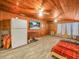 Cozy living room with wood ceiling and dog in a crate, complete with a TV and comfortable seating at 2120 Dille St, Lakeland, FL 33815