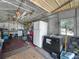 The garage is filled with home improvement items, tools, and an extra refrigerator at 2120 Dille St, Lakeland, FL 33815