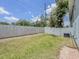 Spacious backyard with a white privacy fence at 222 Carpenters Way # 65, Lakeland, FL 33805