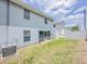 Backyard with privacy fence and green grass at 222 Carpenters Way # 65, Lakeland, FL 33805