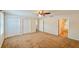 Large bedroom with closet and doorways offers ample space and access to other areas at 222 Carpenters Way # 65, Lakeland, FL 33805