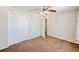 Bedroom featuring a ceiling fan, closet, and neutral paint at 222 Carpenters Way # 65, Lakeland, FL 33805