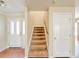 Entryway featuring a staircase and white front door with glass panes at 222 Carpenters Way # 65, Lakeland, FL 33805