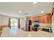 Kitchen showcasing stainless steel appliances, countertops, and access to the backyard at 222 Carpenters Way # 65, Lakeland, FL 33805