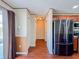 Open kitchen layout featuring stainless steel appliances and wood cabinets with easy access to the living area at 222 Carpenters Way # 65, Lakeland, FL 33805