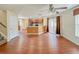 View of living area with open kitchen, stainless appliances, and hard surface floors at 222 Carpenters Way # 65, Lakeland, FL 33805