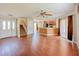 Open floor plan featuring hard surface floors, stairs, and a combined kitchen and living space at 222 Carpenters Way # 65, Lakeland, FL 33805