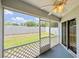 Screened in patio with a ceiling fan and views of the backyard at 222 Carpenters Way # 65, Lakeland, FL 33805