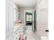 Well-lit bathroom with stylish vanity, tiled floors and walk-in shower at 2331 D R Bryant Rd, Lakeland, FL 33810