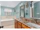 Bathroom with double sink vanity, granite countertops, large soaking tub and nautical themed decorations at 2331 D R Bryant Rd, Lakeland, FL 33810
