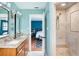 Stylish bathroom showcasing double vanity with stone counters and walk-in shower at 2331 D R Bryant Rd, Lakeland, FL 33810