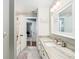 Bright bathroom with a large vanity, tile floors, and a shower with tub at 2331 D R Bryant Rd, Lakeland, FL 33810