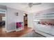Charming bedroom with hardwood floors, ceiling fan, and a bunk bed at 2331 D R Bryant Rd, Lakeland, FL 33810