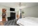 Bright bedroom with ensuite bathroom access, wood floors, a geometric rug and walk-in closet at 2331 D R Bryant Rd, Lakeland, FL 33810
