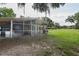 Well-built chicken coop with enclosed area and sheltered run, situated on a sprawling green pasture at 2331 D R Bryant Rd, Lakeland, FL 33810