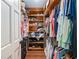 Walk-in closet with wooden organizers and shelving for shoes, clothes and storage at 2331 D R Bryant Rd, Lakeland, FL 33810