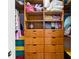 Walk-in closet with built-in wooden storage shelves and drawers at 2331 D R Bryant Rd, Lakeland, FL 33810