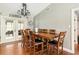 Dining room with a large wooden table, seating for eight, and access to an adjacent living space at 2331 D R Bryant Rd, Lakeland, FL 33810
