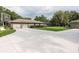 Wide driveway leads to the three-car garage, with basketball hoop, and screened-in pool in the back at 2331 D R Bryant Rd, Lakeland, FL 33810