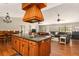 Open kitchen with island cooktop and counter seating open to living and dining areas at 2331 D R Bryant Rd, Lakeland, FL 33810
