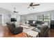 Cozy living area featuring a large sectional, rich wood flooring, and stylish decor at 2331 D R Bryant Rd, Lakeland, FL 33810
