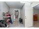 Functional mud room with storage shelves, a water heater, and access to the interior of the house at 2331 D R Bryant Rd, Lakeland, FL 33810