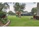 Fun backyard playground with swings, a slide, and a playhouse for hours of outdoor enjoyment at 2331 D R Bryant Rd, Lakeland, FL 33810