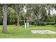 Backyard playground with a climbing rope, swings, a slide, and a sandbox for outdoor fun at 2331 D R Bryant Rd, Lakeland, FL 33810