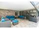 Covered porch with brick wall, tile floor, ceiling and comfortable outdoor seating at 2331 D R Bryant Rd, Lakeland, FL 33810
