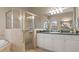 Bathroom featuring a glass-enclosed shower, sink with vanity, and view of the corner soaking tub at 2593 Colonel Ford Dr, Lakeland, FL 33813