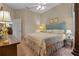 Cozy bedroom with carpet, window, and a bed, complemented by wooden furniture and lamps at 2593 Colonel Ford Dr, Lakeland, FL 33813