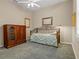 Spacious bedroom featuring a ceiling fan, carpeted floor, and ample natural light from the window at 2593 Colonel Ford Dr, Lakeland, FL 33813