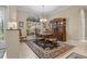 Elegant dining room featuring a large window, classic furnishings, and a patterned rug, perfect for gatherings at 2593 Colonel Ford Dr, Lakeland, FL 33813