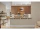 Kitchen pass-through bar area featuring granite countertops, and view of the dining area at 2593 Colonel Ford Dr, Lakeland, FL 33813