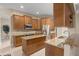Well-lit kitchen with granite countertops, stainless steel appliances, and island workspace at 2593 Colonel Ford Dr, Lakeland, FL 33813