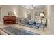 Traditional living room featuring sofas, piano, elegant decor, and access to the patio at 2593 Colonel Ford Dr, Lakeland, FL 33813