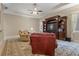 Spacious living room boasts a ceiling fan, built-in shelving, and comfortable seating at 2593 Colonel Ford Dr, Lakeland, FL 33813