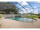 A refreshing screened-in pool offers a private and relaxing outdoor oasis at 2593 Colonel Ford Dr, Lakeland, FL 33813