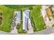 Aerial view showcasing the home's layout, including the house, RV parking, and the surrounding community at 3261 Fish Hawk Dr, Polk City, FL 33868