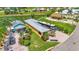 Aerial view of the property showcasing its layout, including the house, RV parking, and surrounding landscaping at 3261 Fish Hawk Dr, Polk City, FL 33868