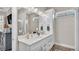 Bathroom with double vanity, plenty of storage and enclosed glass shower at 3261 Fish Hawk Dr, Polk City, FL 33868