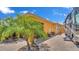 Exterior of home with brick pavers, RV parking, and tropical landscaping at 3261 Fish Hawk Dr, Polk City, FL 33868