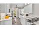 Bright kitchen with modern appliances, white cabinetry and eat-in bar at 3261 Fish Hawk Dr, Polk City, FL 33868