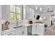 Well-lit kitchen with stainless steel appliances and adjacent living space, perfect for entertaining guests at 3261 Fish Hawk Dr, Polk City, FL 33868