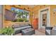 Inviting lanai with comfortable seating, offering relaxing views of palm trees and the surrounding landscape at 3261 Fish Hawk Dr, Polk City, FL 33868