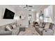 Cozy living room with comfortable seating, a flat-screen TV, and stylish decor, perfect for relaxing at 3261 Fish Hawk Dr, Polk City, FL 33868